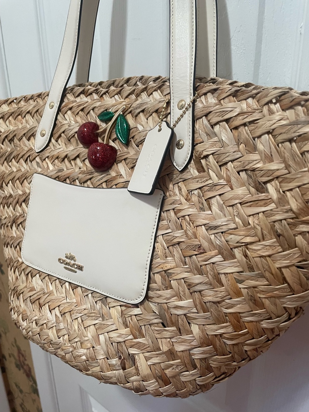 Coach Straw Tote with White Leather Trim and Red Cherry Charm